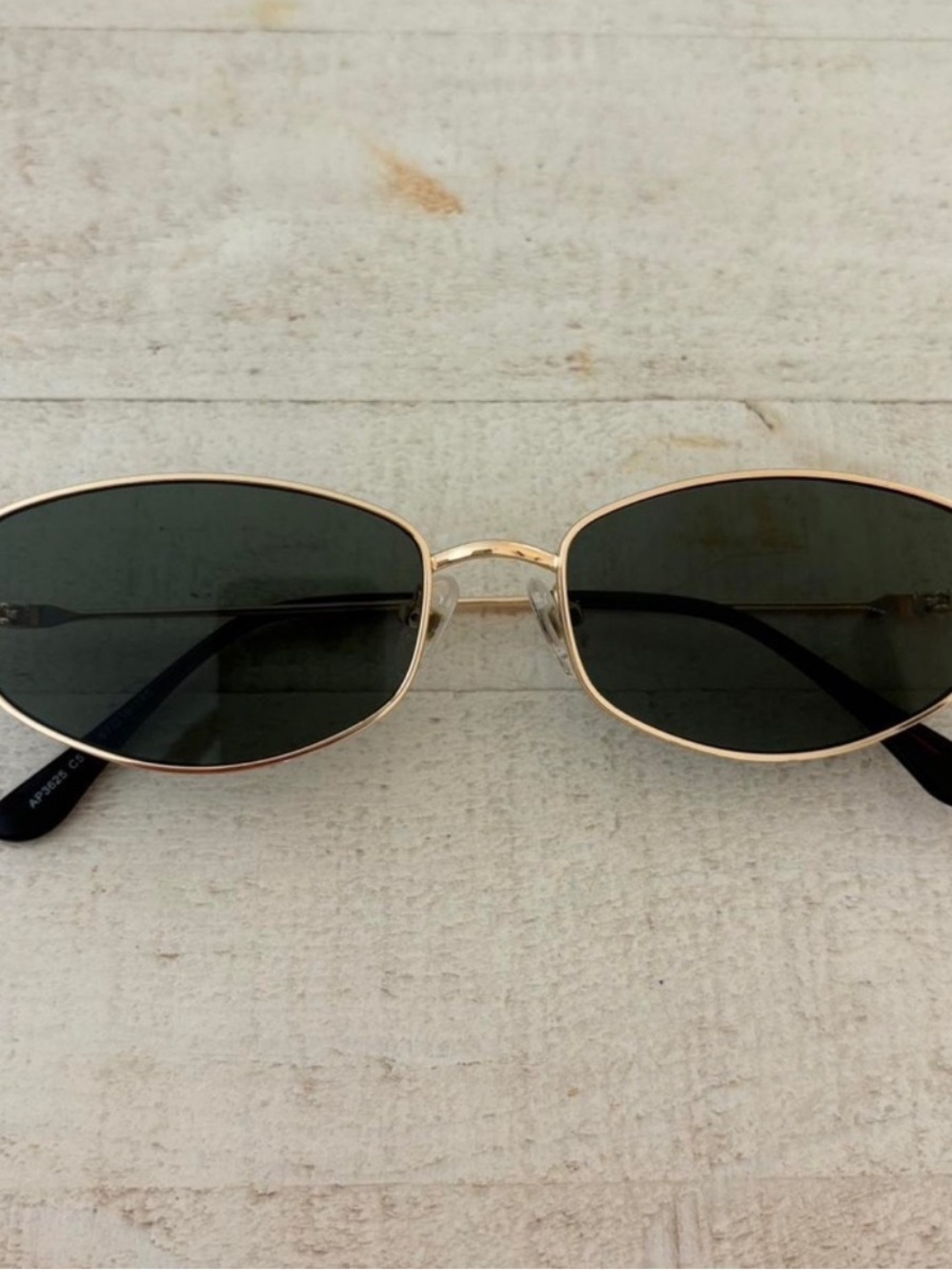 Women’s gold frame sunglasses